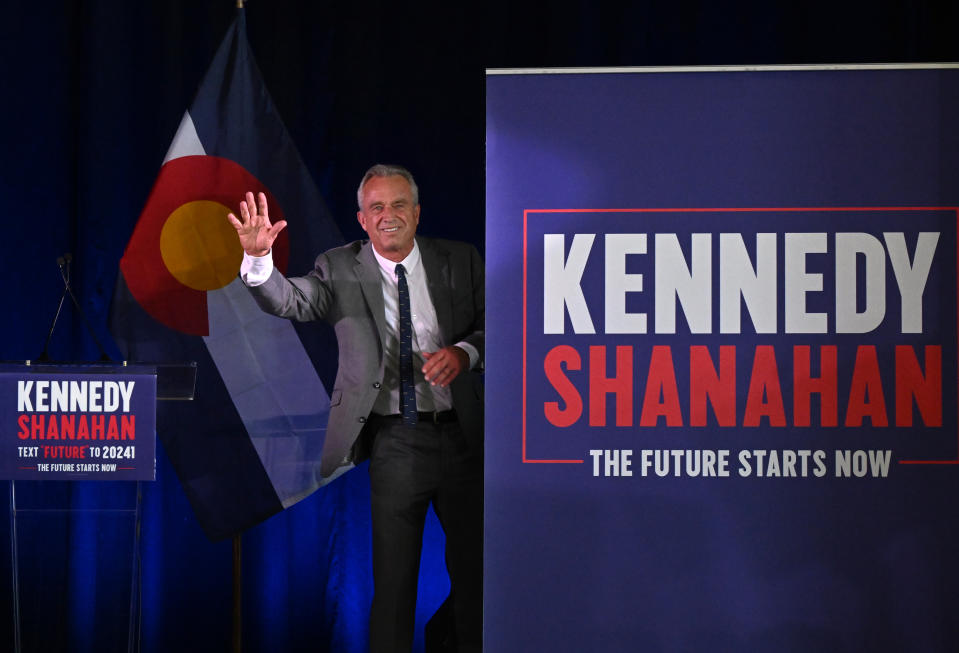 AURORA, CO - MAY 19: Independent presidential candidate Robert F. Kennedy Jr. waves to the crowd as he leaves the stage after speaking at a campaign rally at the Hangar at Stanley Marketplace in Aurora, Colorado, on May 19, 2024. Kennedy spoke about his plans for 