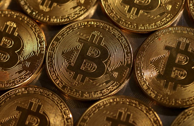 Volatile bitcoin falls from record low as crypto frenzy takes pause