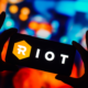 In this photo illustration, the Riot Platforms (RIOT) logo is displayed on a smartphone screen.