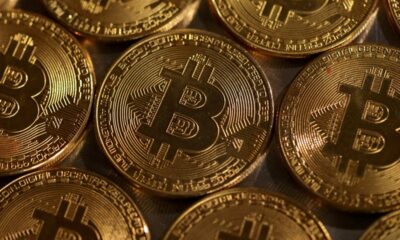 Bitcoin hits record high, then tumbles