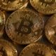 Bitcoin hits record high, then tumbles