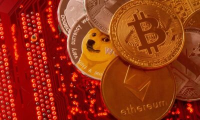 FILE PHOTO: FILE PHOTO: Representations of cryptocurrencies Bitcoin, Ethereum, DogeCoin, Ripple, Litecoin are placed on PC motherboard in this illustration taken